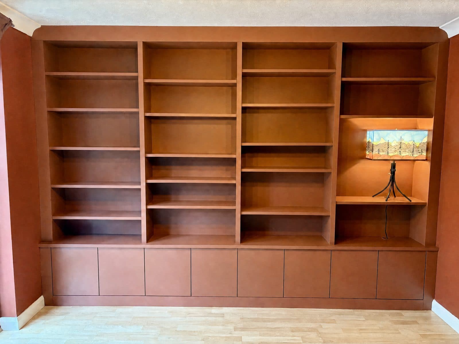Red hand-painted bespoke bookcase with fitted shelving